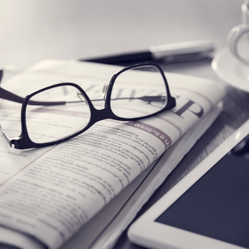 Newspaper and glasses